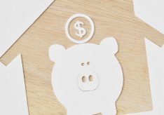 Piggy bank and buying a house project - Saving money for future concept